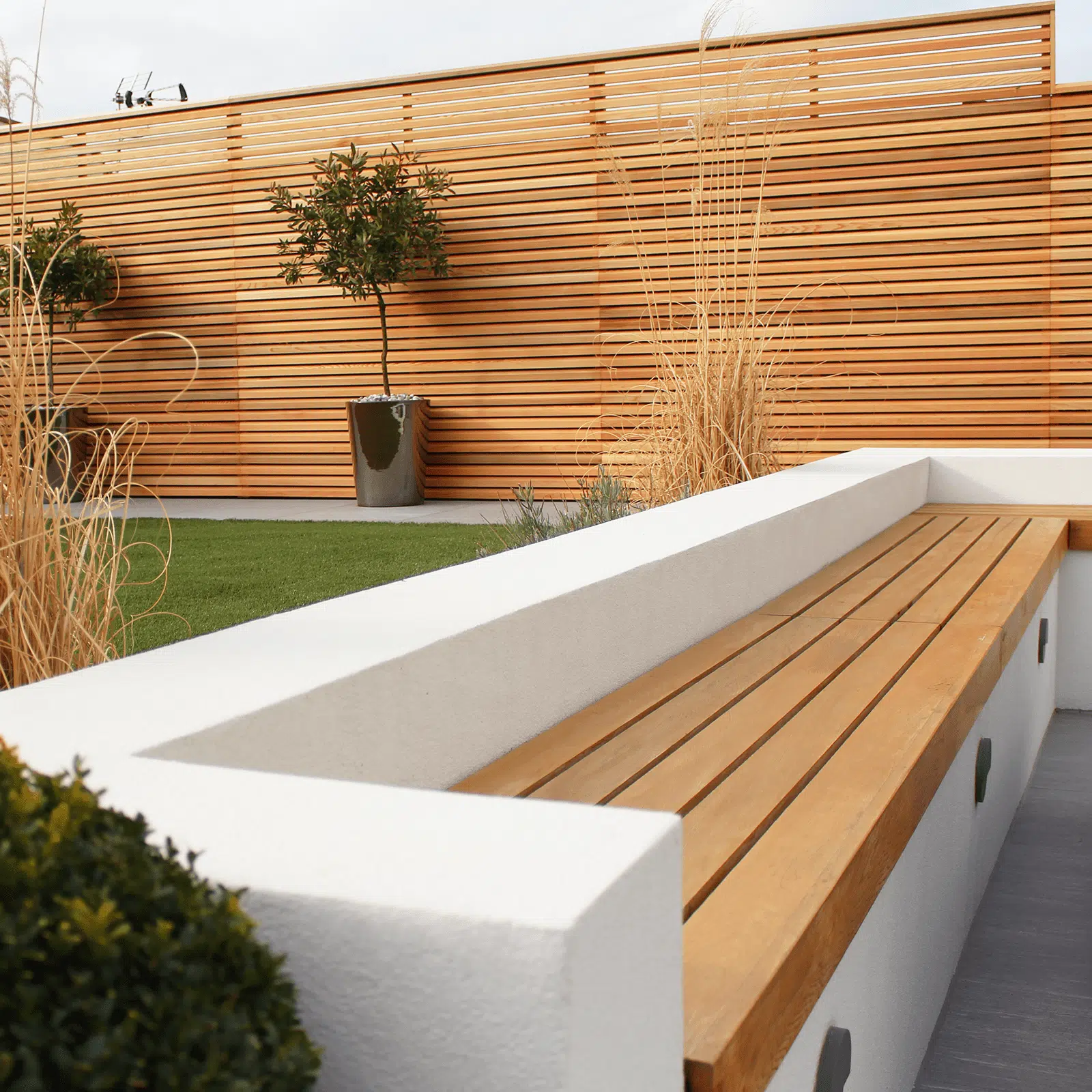 Dual Purpose Retaining Walls with Privacy Screens